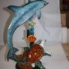 Dolphin with two fish and one turtle Statue -  Size: 22"L x 12"W x 32"H.