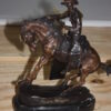 Remington Cowboy on marble Bronze Statue -  Size: 10"L x 3.5"W x 10"H.