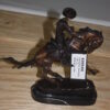 Remington Cowboy on marble Bronze Statue -  Size: 10"L x 3.5"W x 10"H.