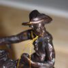 Remington Cowboy on marble Bronze Statue -  Size: 10"L x 3.5"W x 10"H.