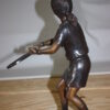 Girl Playing Tennis - Bronze Statue -  Size: 10"L x 11"W x 21"H.