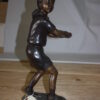 Girl Playing Tennis - Bronze Statue -  Size: 10"L x 11"W x 21"H.