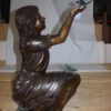 Girl with butterflies  - Bronze Statue -  Size: 27"L x 17"W x 24"H.