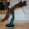 Eagle on a wave - Bronze Statue -  Size: 32"L x 12"W x 34"H.