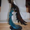 Eagle on a wave - Bronze Statue -  Size: 32"L x 12"W x 34"H.