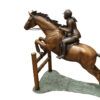 Jockey and Horse Jump a Fence Bronze Statue -  Size: 60"L x 30"W x 51"H.