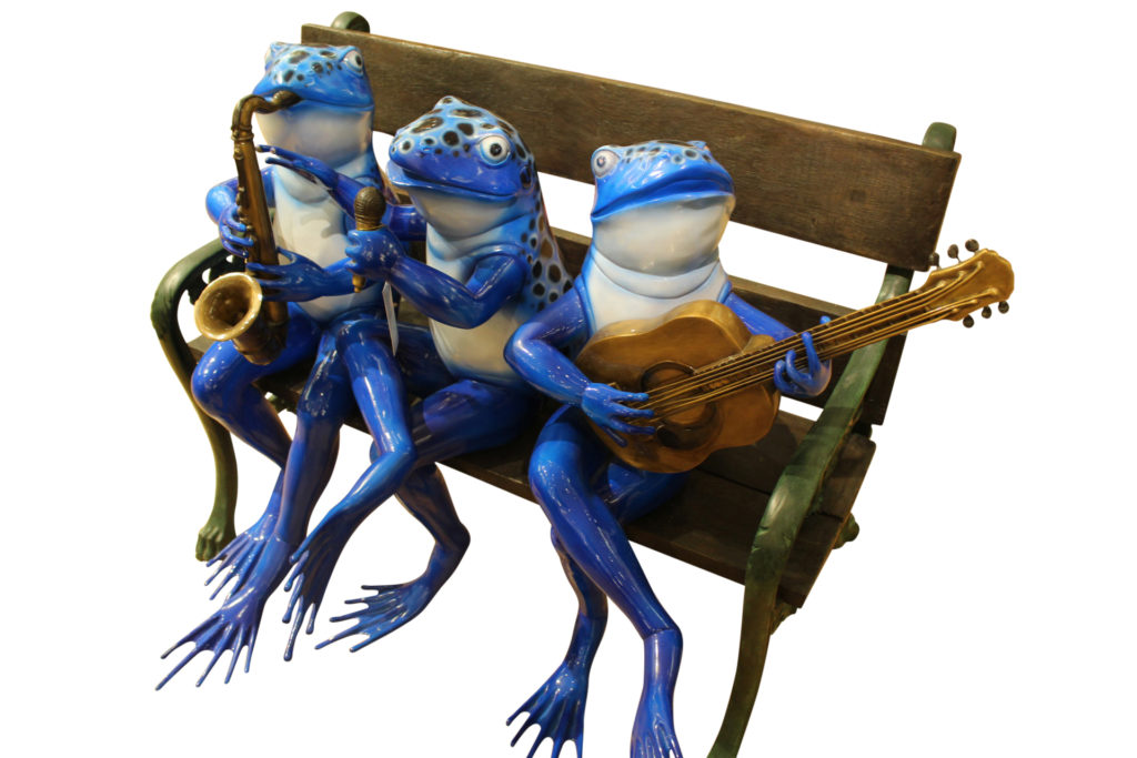 frogs on a bench garden statue