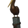 Pelican on a Stump Bronze Statue -  Size: 14"L x 38"W x 58"H.