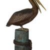 Pelican on a Stump Bronze Statue -  Size: 14"L x 38"W x 58"H.