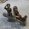 Two kids with dog on log Bronze Statue -  Size: 12"L x 5"W x 8.5"H.