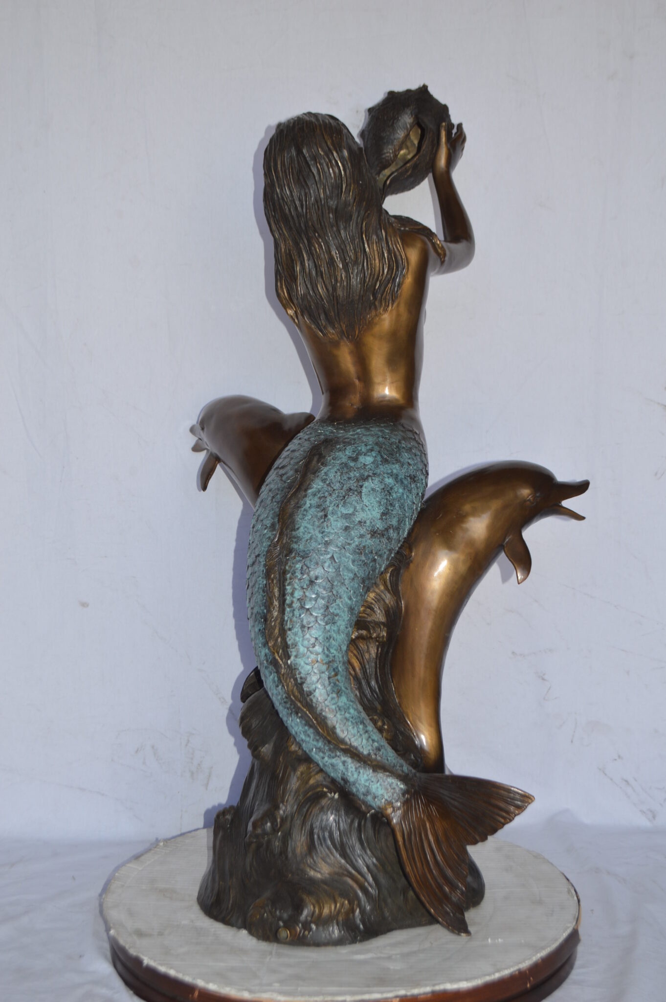 large outdoor mermaid statues