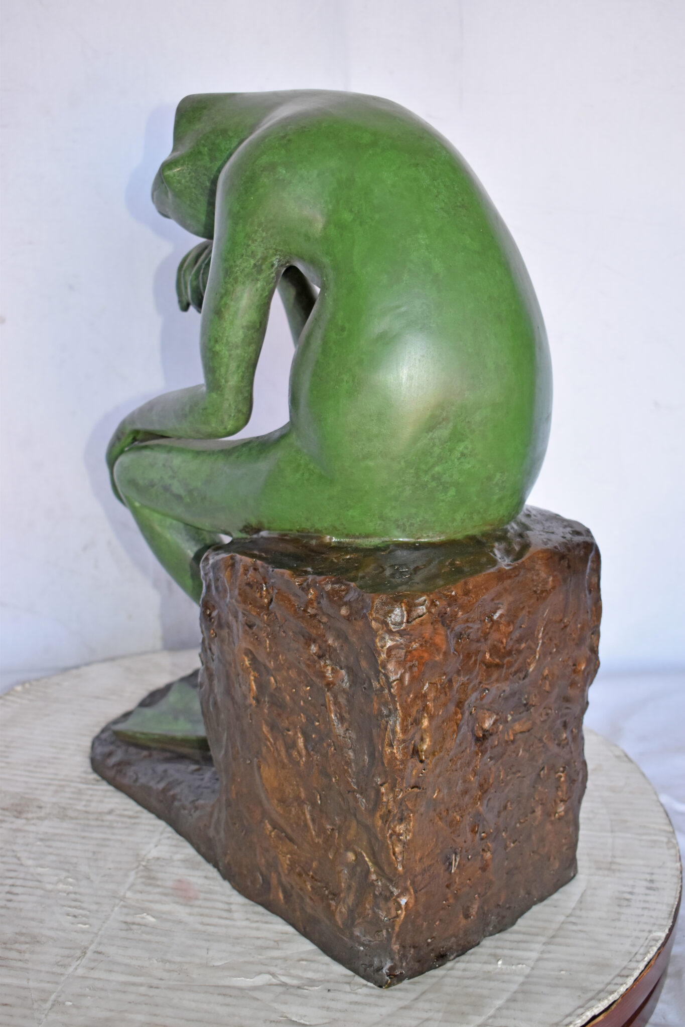 thinking frog statue